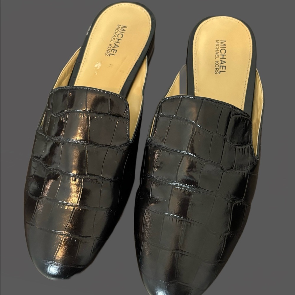 Michael Kors size 7 black leather mule with silver accent heels.